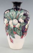Moorcroft vase decorated with foliage and berries dated 2002, H16cm