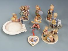 A collection of Goebel Hummel figures, pin tray, tableau etc, tallest 14cm