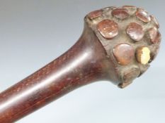 A 19thC carved ironwood Fijian Bulibuli tribal war club, the characteristic tapering domed head