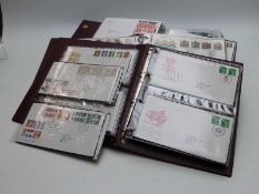 Four Royal Mail First Day Cover albums containing covers from 1984 to 2003