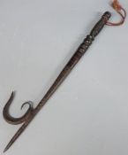 A tribal hardwood and metal elephant goad, 46cm long