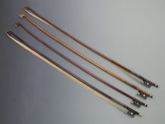 Four violin bows, one by C Mullans with mother of pearl eye to frog, 51g, one by Cremona, 57g,