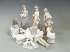 A collection of Nao figures, swans etc, tallest 25cm