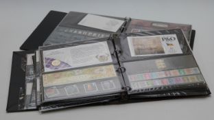 Two albums of mint stamps, definitives, presentation packs and booklets. Face value at least £370