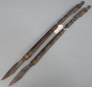 Pair of African or possibly Dayak, Borneo carved hardwood slashing or skinning knives with branded
