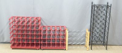 Four wine racks, largest H102cm