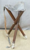 Dark wood shooting stool with metal feet