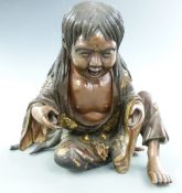 Japanese bronze figure of a young man with textured and gilt decoration, signed to base, H16.5cm
