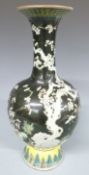 A 19thC Chinese famille noir pedestal vase with prunus decoration, 40cm