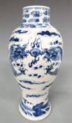 Chinese 19thC blue and white vase depicting two dragons chasing a flaming pearl, 22cm tall