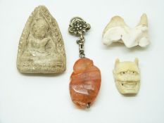 Chinese agate carving of a monkey, an ivory netsuke of a man/devil and a stone carving of Guanyin