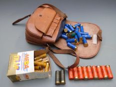 A collection of 12 bore shotgun cartridges together with a leather cartridge bag. PLEASE NOTE THAT A