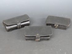 Three American Civil War era leather pouches, one with fitted wooden cartridge holder