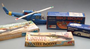 Four vintage toys and models comprising Clifford Toys battery operated Ski-Boat, Motorway Patrol 3.8