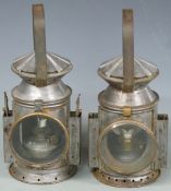 Two military railway or similar tri colour hand lamps, one by Eastgate & Son, Birmingham and dated