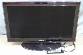 Samsung flatscreen television with accessories, W100cm