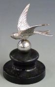 Vintage car mascot formed as a bird with sphere below, on ebonised base, overall height 11.5cm