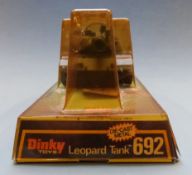 Three Dinky Toys diecast model military vehicles Scorpion Tank 690, Striker Anti-Tank Vehicle 691