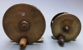 Two brass fishing reels, possibly Hardy, diameter 7.7 and 9.4cm