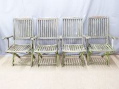 Set of four teak folding garden chairs