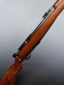 Mauser .22 bolt-action rifle with semi-pistol grip, leather sling, adjustable sights and 26 inch