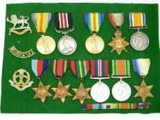 A mounted medal display comprising British Army WWI Military Medal and Victory Medal named to