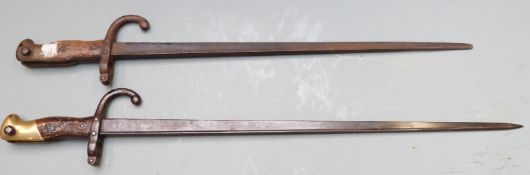 Two French 1874 pattern Gras bayonets, both with downswept quillon, blade lengths 47cm & 52cm