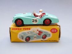 Dinky Toys diecast model Triumph TR2 Sports with mint green body, red interior and hubs, white