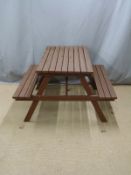 A stained pine picnic bench W135 D128 H75cm