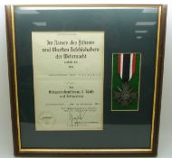 German Third Reich Nazi War Merit Cross with Swords medal, framed with certificate