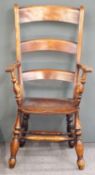 A 19thC mahogany armchair with three shaped back splats raised on turned legs