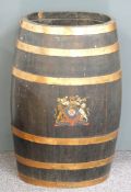 A coopered oak barrel in the form of a stick or umbrella stand marked with an armorial crest, H62