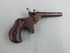 J G Anchutz .177 blank firing hammer action cyclists pocket or muff pistol with shaped grips and 2.5