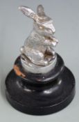 Desmo vintage car mascot formed as a seated rabbit, on ebonised base, overall height 12.5cm