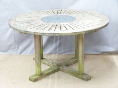 A circular teak garden table, diameter 132cm