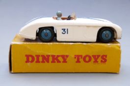 Dinky Toys diecast model Cuningham C-5R Road Racer with white body, pale blue hubs and driver, tan