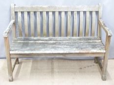 A hardwood garden bench, W122cm