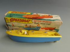 Marx Speedboat battery operated High Speed Craft with yellow deck and blue hull, in original box.