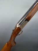 Barasingha 220 12 bore over and under ejector shotgun with engraved lock, top plate and underside,