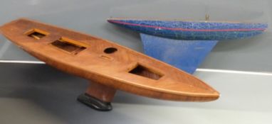 Two wooden model sailing boat/ pond yacht hulls, largest 135cm long.
