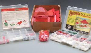 A collection of Bayko building parts together with some instruction booklets.