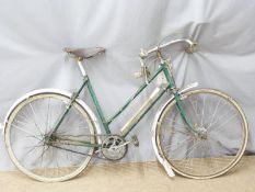 A vintage Raleigh ladies racing bicycle with leather Brooks saddle