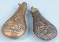 Two copper and brass powder flasks both with embossed decoration of game to both sides, largest 19.
