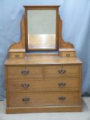 Art Noveau oak dressing chest with bevelled glass mirror, W120 D58 H170cm