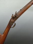 Unnamed flintlock hammer action gun with engraved lock and trigger guard, brass tipped wooden ram-