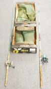 Two fishing rods with reels, one Mitchell 600 the other Adventure AD40 together with two pairs of