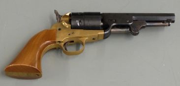 Six-shot single action blank firing revolver with brass frame, shaped wooden grips and 5 inch