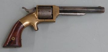 Lucius W Pond .32 six-shot single action rimfire revolver with brass frame shaped wooden grips,