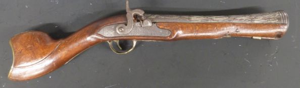 Percussion hammer action blunderbuss with engraved lock, heavily carved stock, brass trigger