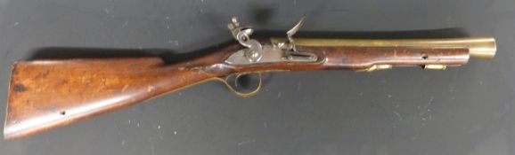 Flintlock hammer action blunderbuss with engraved lock and hammer, brass trigger guard, butt plate